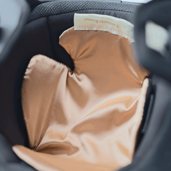 Champagne colored satin helmet liner inside helmet